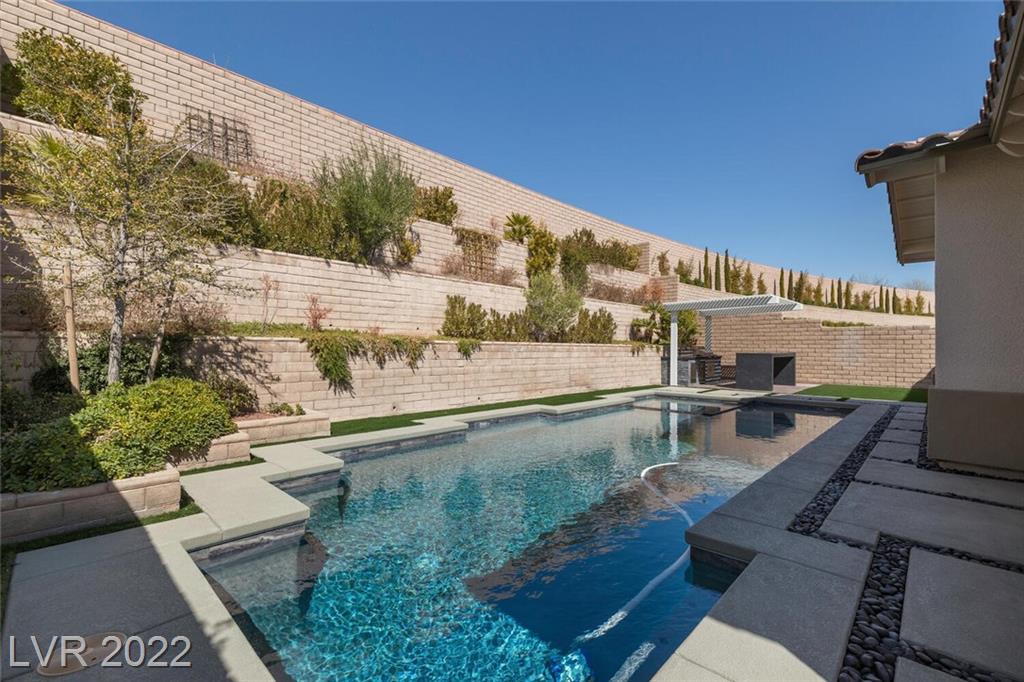Finished Impact project: wide view showing the pool, landscape, hardscape and retaining walls