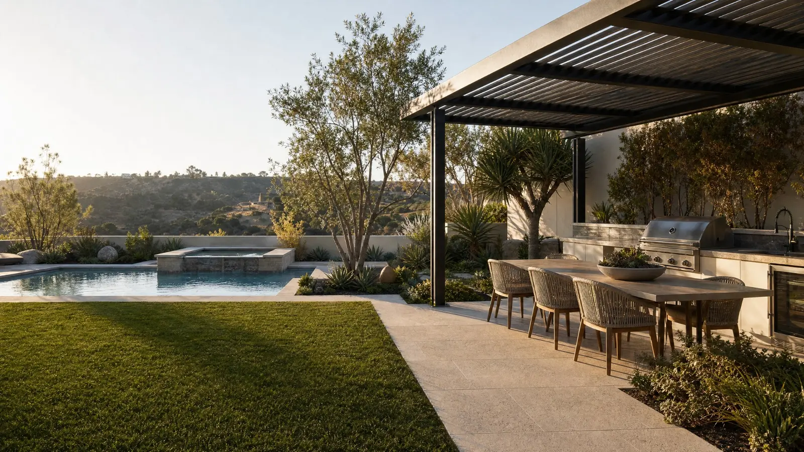 Illustrative family backyard concept with turf, a pool and covered outdoor kitchen